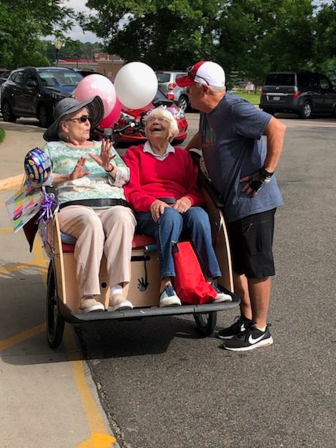 76 - tri shaw riders people on the back patio